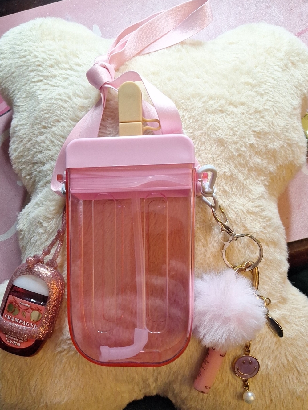 Pink Clear Pouch Crossbody with Pom Keychain And Sanitizer.
